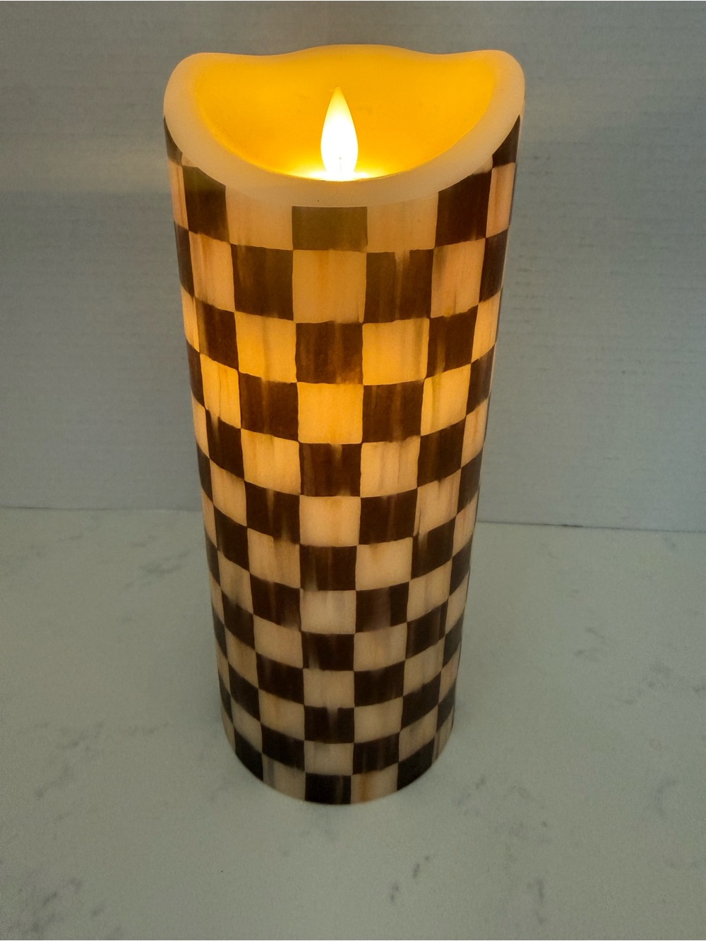 Mackenzie-Child’s black and cream Checkered Courtly Check flameless candle.